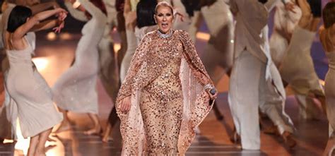 Celine Dion sparkles in pink cape gown as she performs